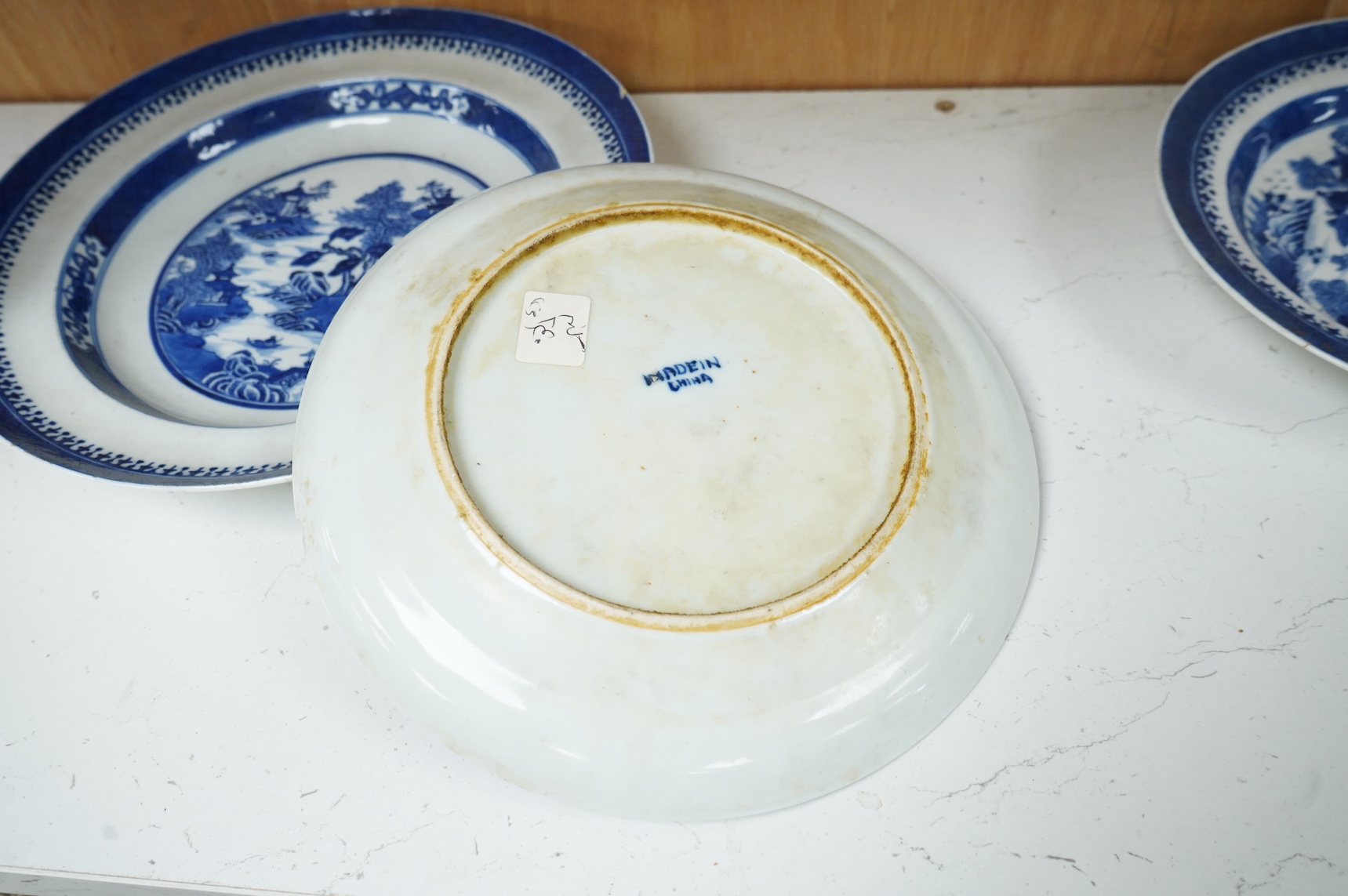 Five 18th / 19th century Chinese export blue and white plates and dishes, largest 27cm in diameter